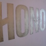 plaster and gold leaf sign on wall for "HONOR" show during fashion week 2010, NYC