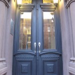 brownstone gilded signage in Harlem